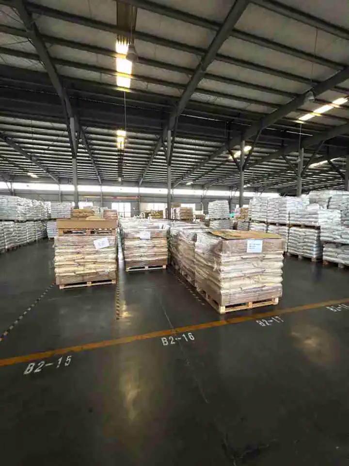 Jinsu warehouse — bagged plastic resin on pallets, ready for global shipment